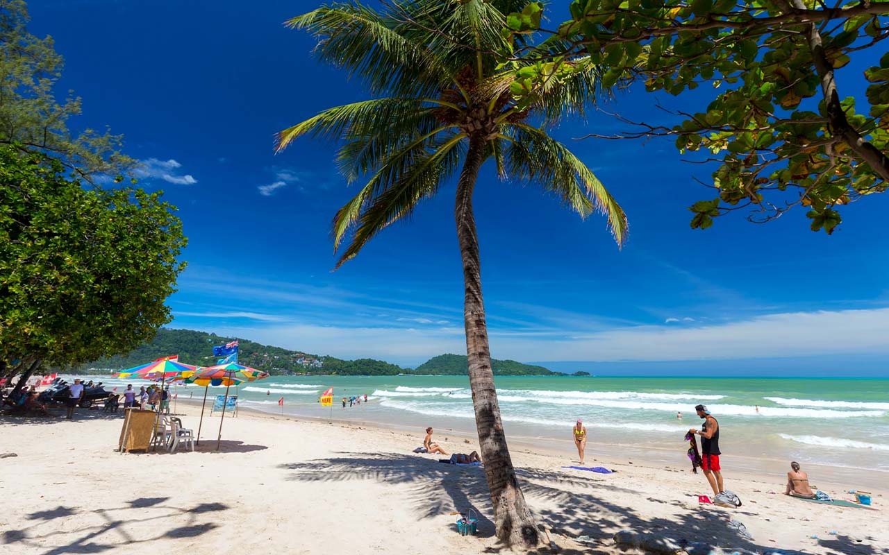 Clear skies and calm waters at Patong Beach in Phuket, showcasing ideal weather during the best time to visit Thailand.