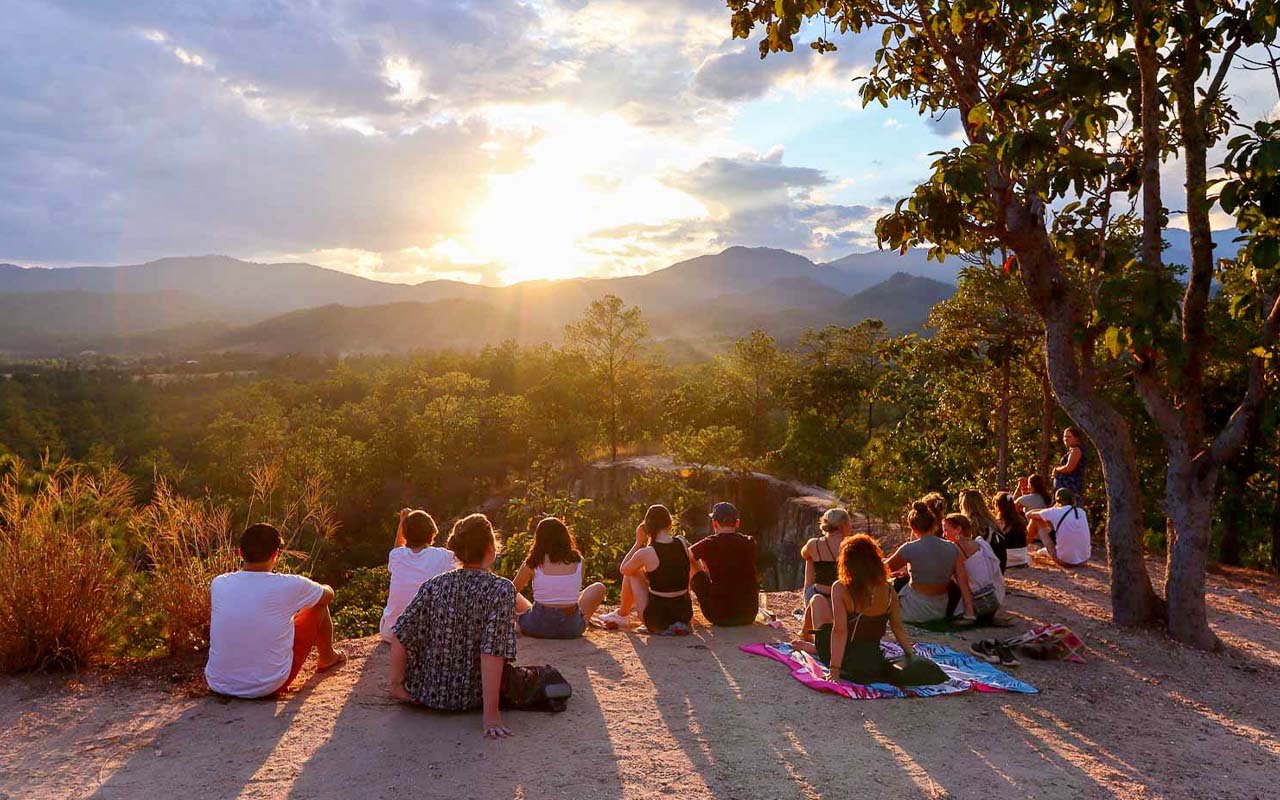 A golden sunset over the rugged cliffs of Pai Canyon, one of the best places to visit in Thailand for nature lovers