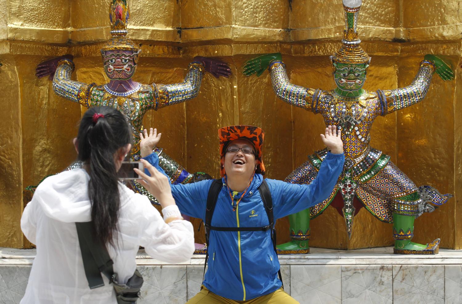 A photo of tourists experiencing Thai culture firsthand